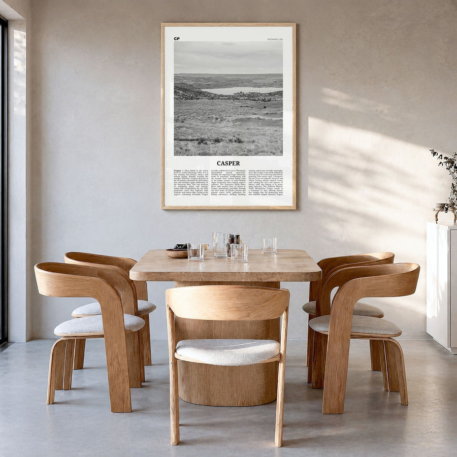 Casper Newspaper Poster in a natural wood frame, hanging in a dining room