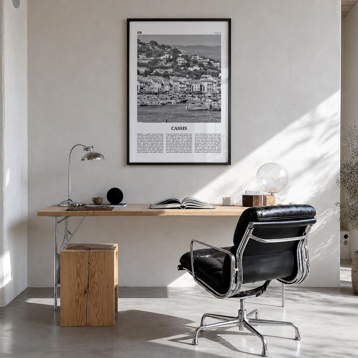 Cassis black & white newspaper poster of France – vertical wall art in black wood frame, hanging on wall