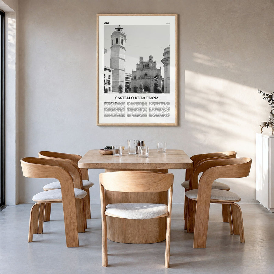 Castelló de la Plana Newspaper Poster in a natural wood frame, hanging in a dining room