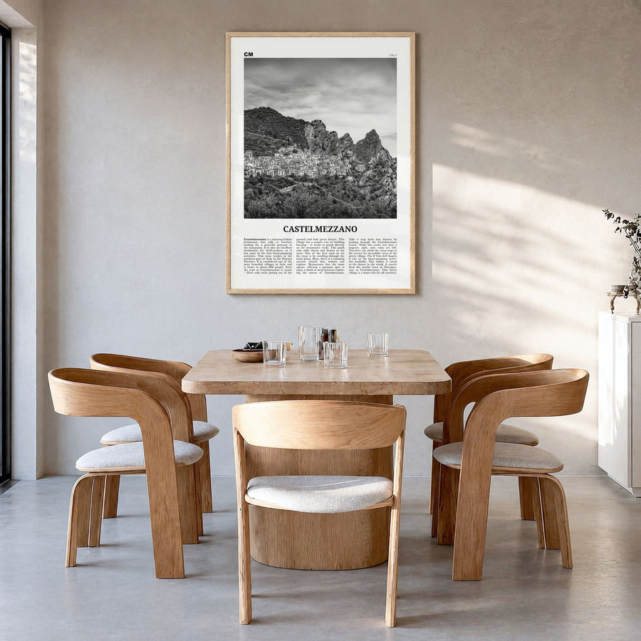 Castelmezzano Newspaper Poster in a natural wood frame, hanging in a dining room