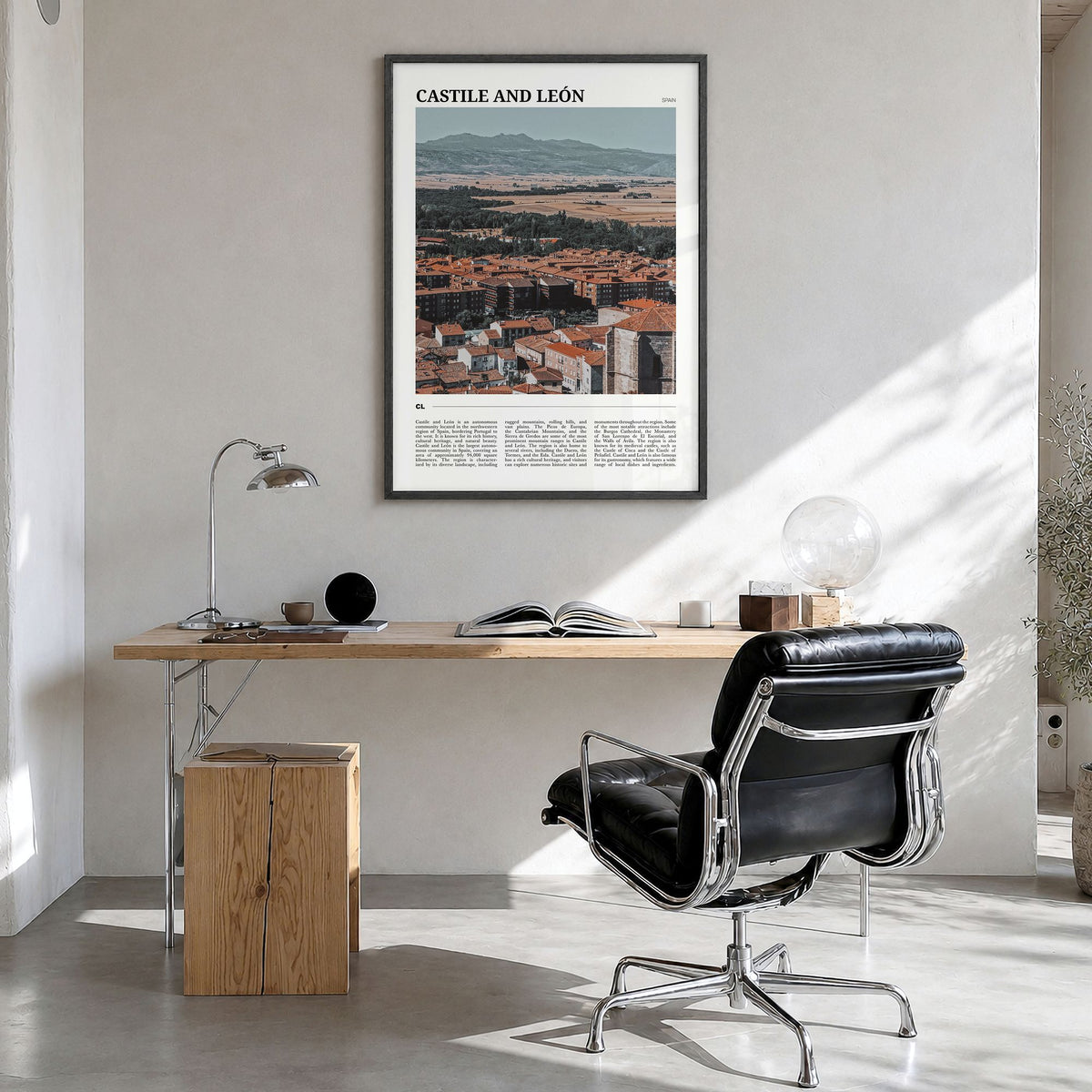 Castile and León Travel Poster in a black wood frame, hanging in a bright home office