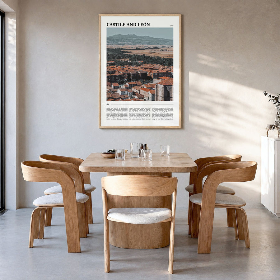 Castile and León Travel Poster in a natural wood frame, hanging in a dining room