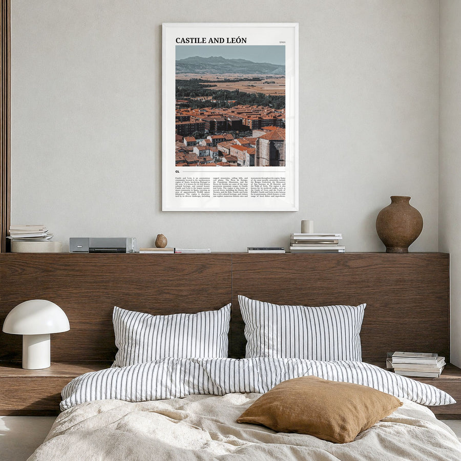 Castile and León Travel Poster in a white wood frame, hanging in a bedroom