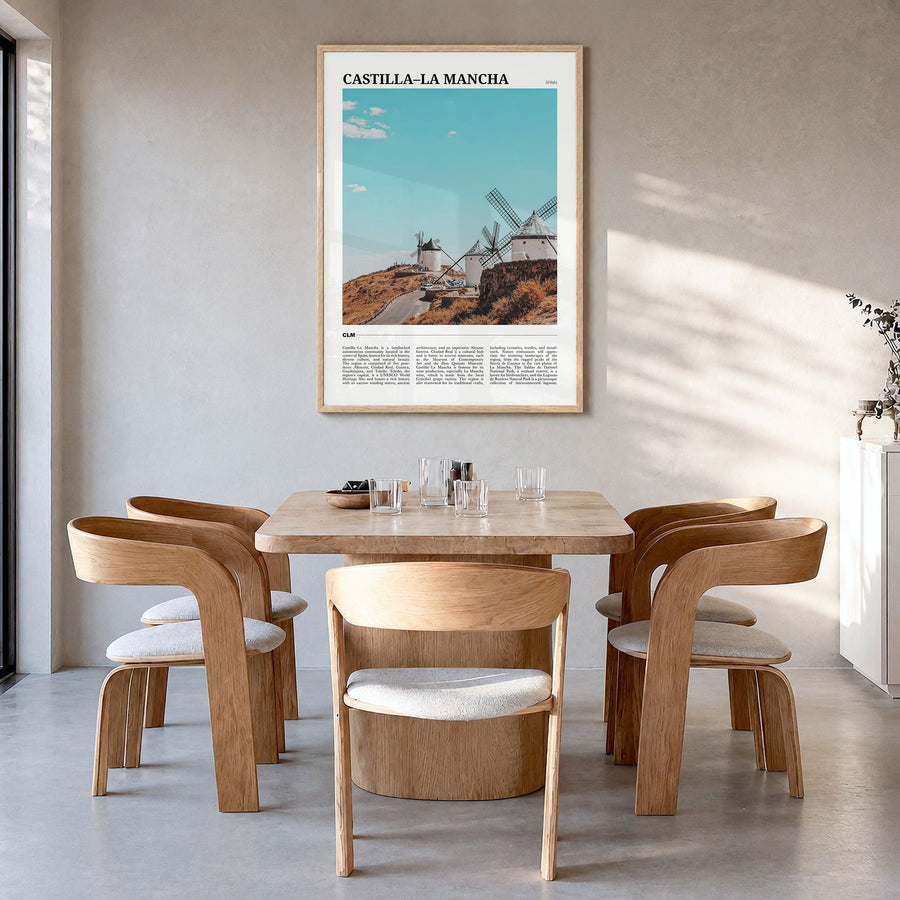 Castilla-La Mancha Travel Poster in a natural wood frame, hanging in a dining room