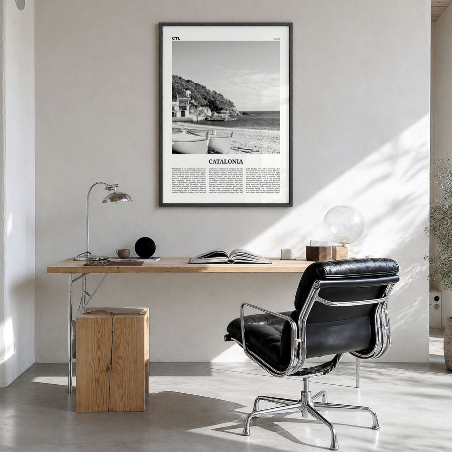 Catalonia Newspaper Poster in a black wood frame, hanging in a bright home office