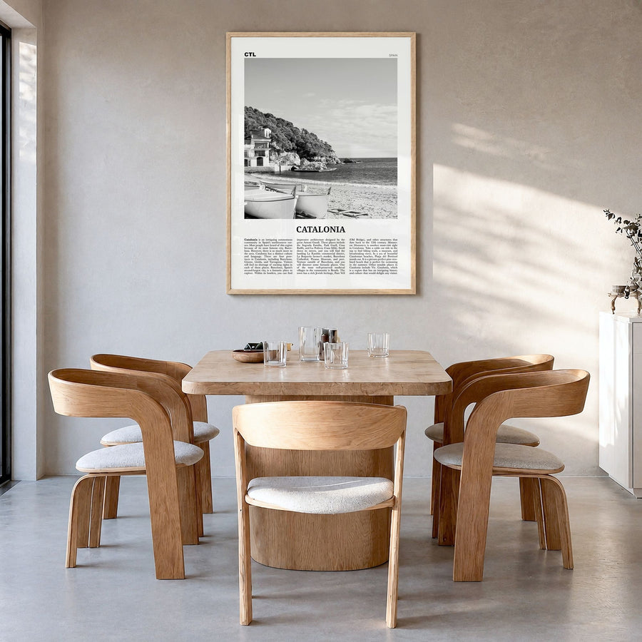 Catalonia Newspaper Poster in a natural wood frame, hanging in a dining room
