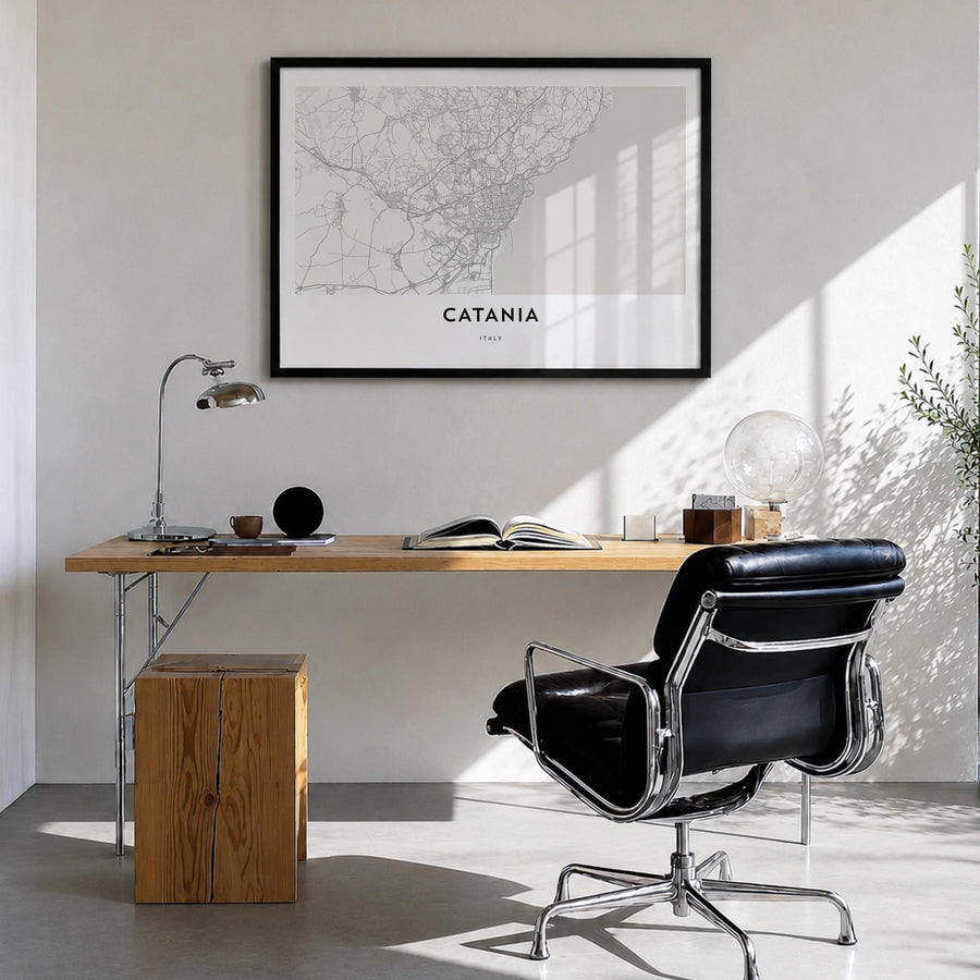 Catania black & white map poster of Italy – horizontal wall art in black wood frame, hanging on wall