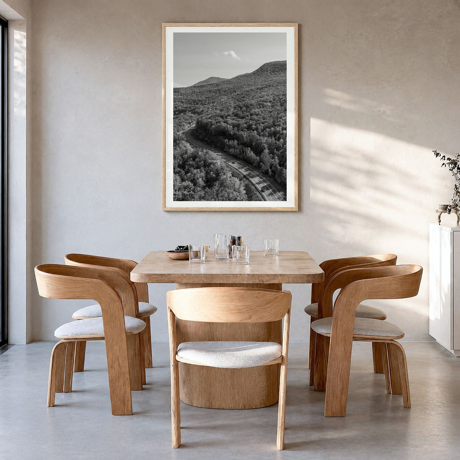 Catskill Mountains Photo Poster in a natural wood frame, hanging in a dining room, white border