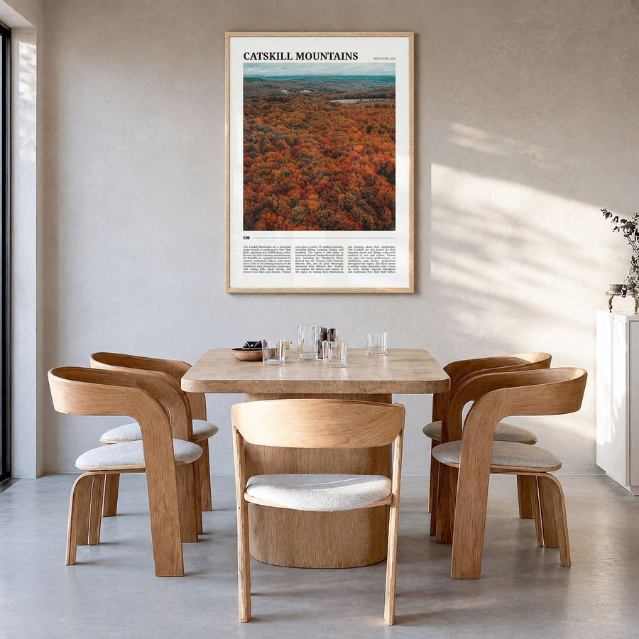 Catskill Mountains Travel Poster in a natural wood frame, hanging in a dining room