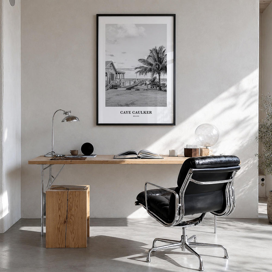 Caye Caulker black & white classic poster of Belize – vertical wall art in black wood frame, hanging on wall