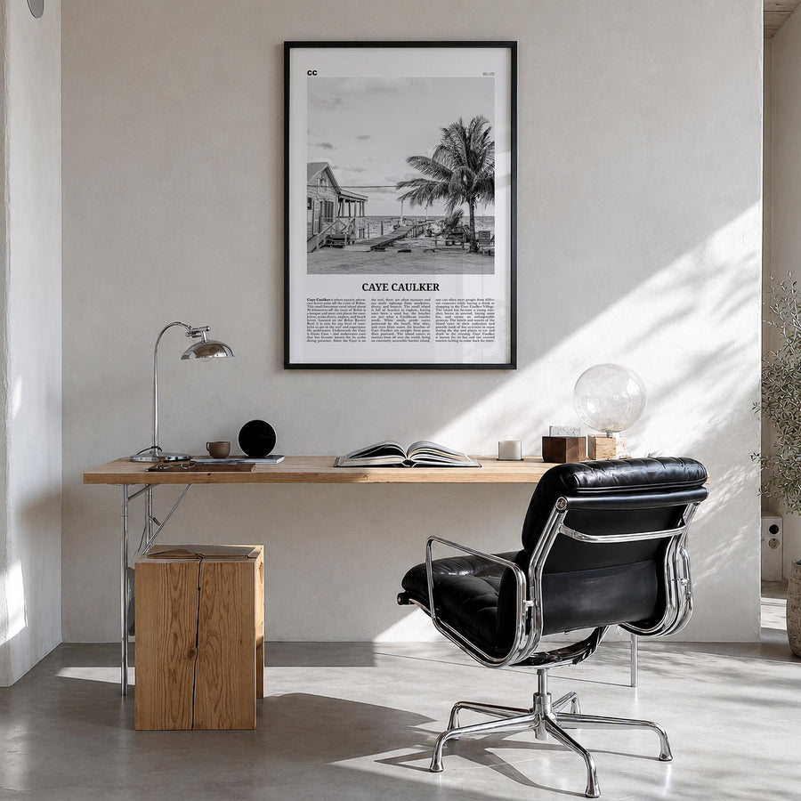 Caye Caulker black & white newspaper poster of Belize – vertical wall art in black wood frame, hanging on wall