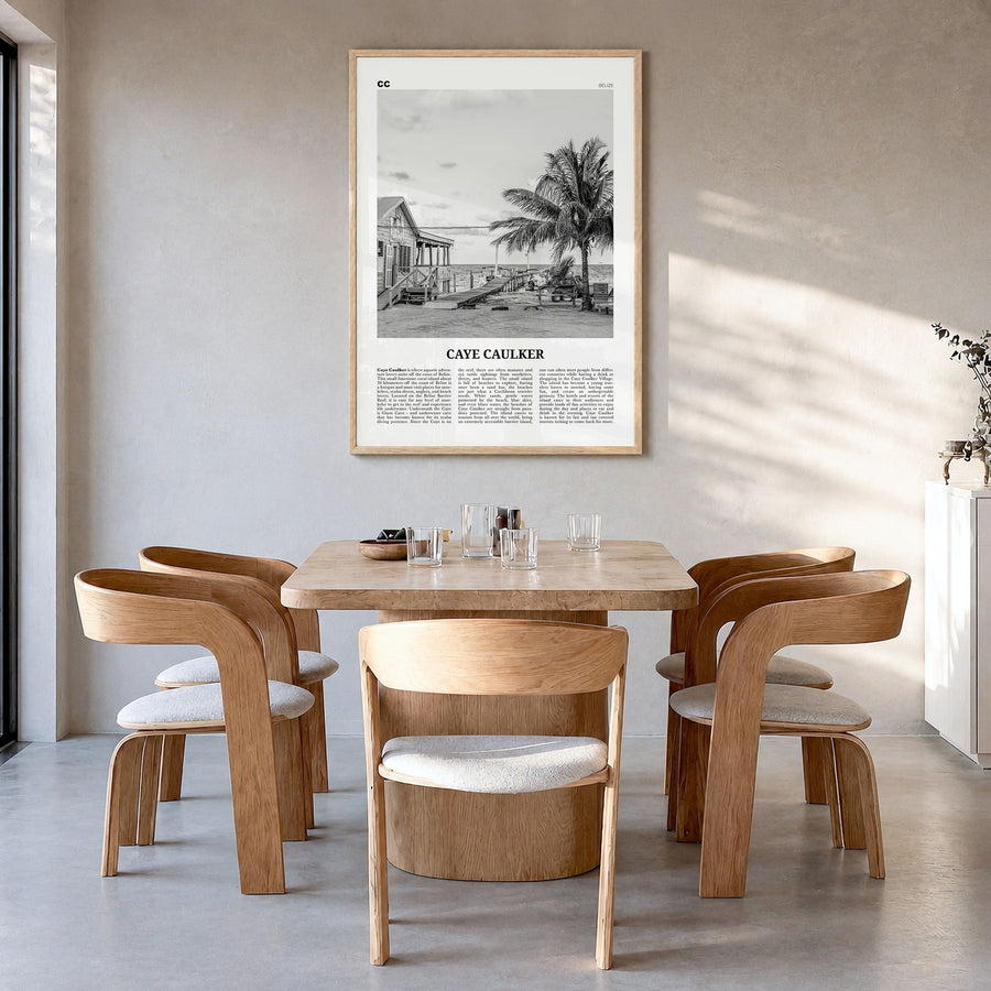 Caye Caulker Newspaper Poster in a natural wood frame, hanging in a dining room