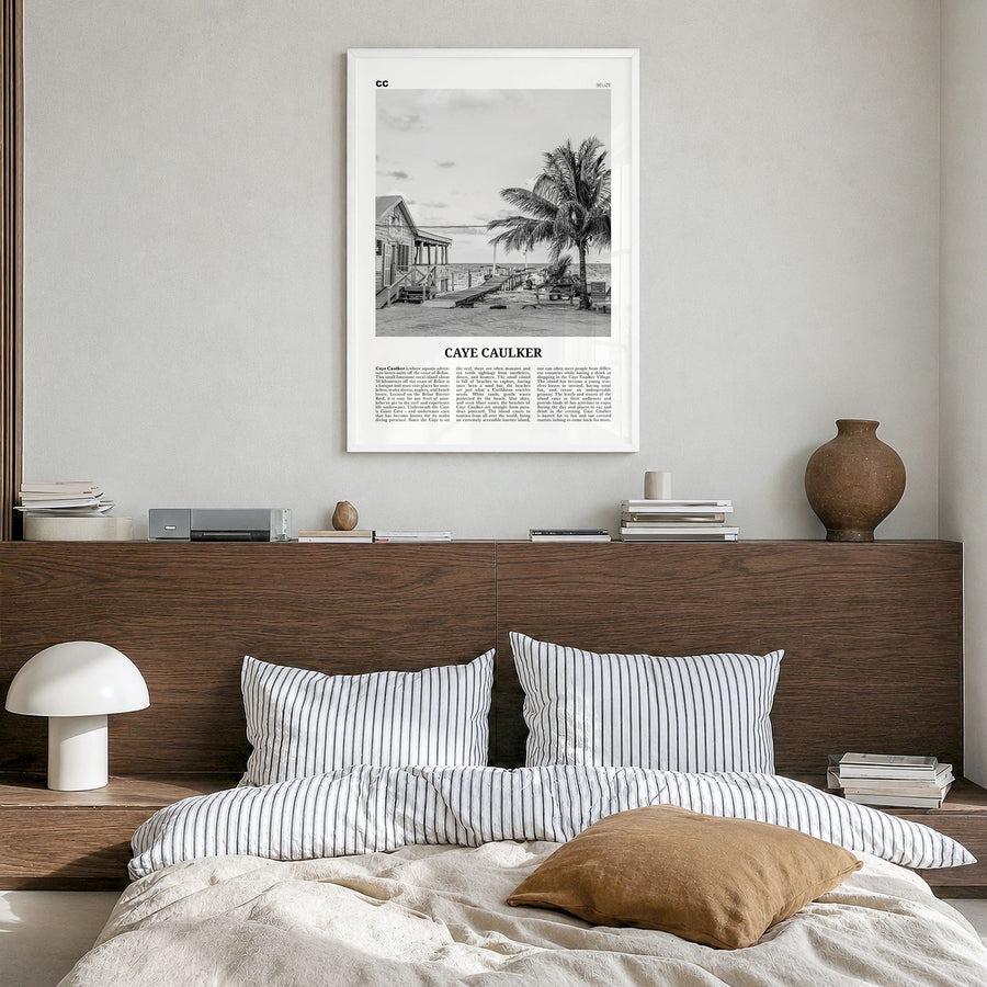 Caye Caulker Newspaper Poster in a white wood frame, hanging in a bedroom