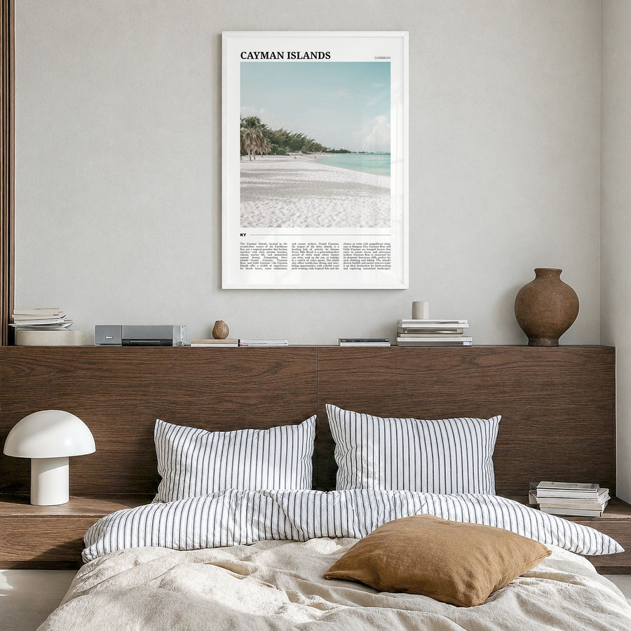 Cayman Islands Travel Poster in a white wood frame, hanging in a bedroom