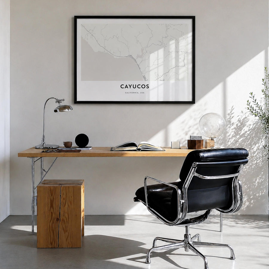 Cayucos black & white map poster of California, USA – horizontal wall art in black wood frame, hanging on wall