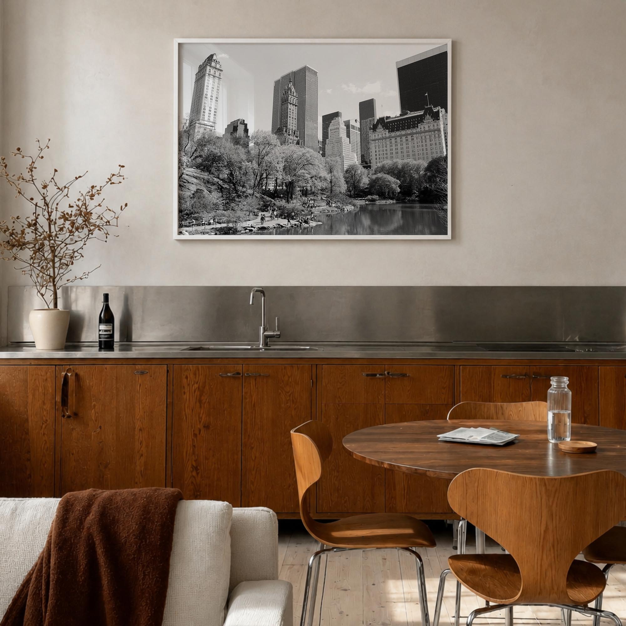 Central Park black & white photo poster of Manhattan, New York City – horizontal wall art in white wood frame, hanging on wal
