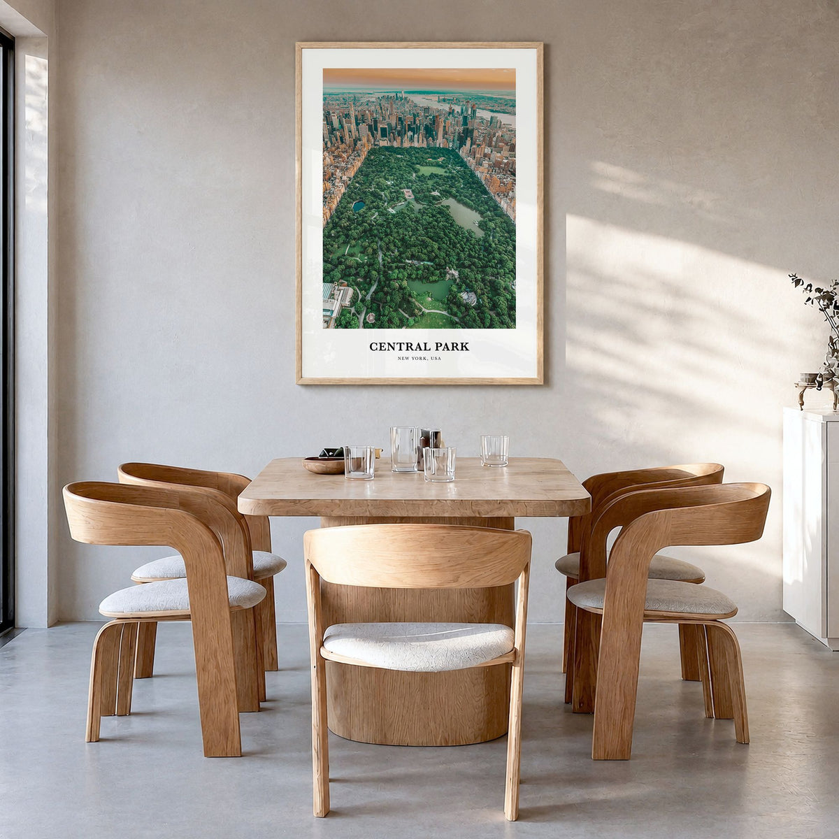 Central Park Classic Poster in a natural wood frame, hanging in a dining room