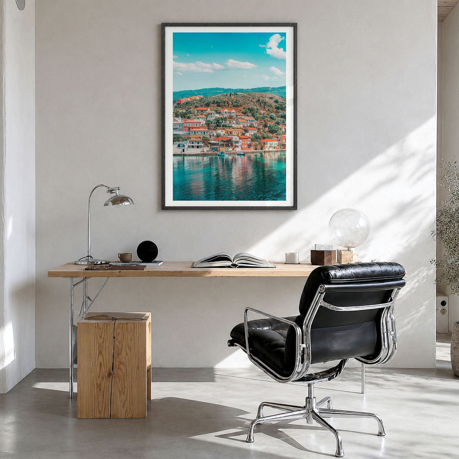 Cephalonia Photo Poster in a black wood frame, hanging in a bright home office, white border