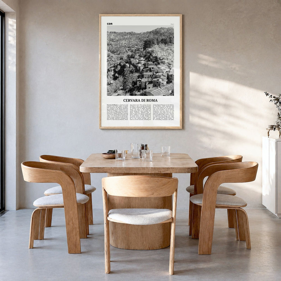 Cervara di Roma Newspaper Poster in a natural wood frame, hanging in a dining room