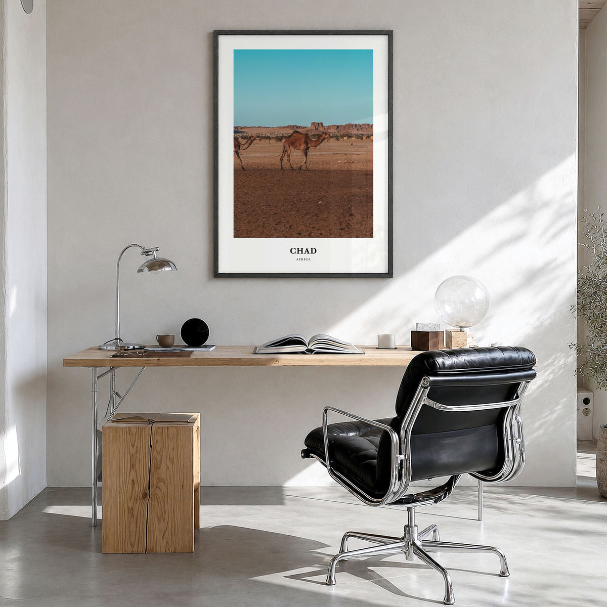 Chad Classic Poster in a black wood frame, hanging in a bright home office