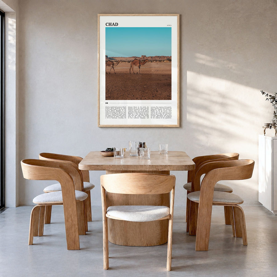 Chad Travel Poster in a natural wood frame, hanging in a dining room