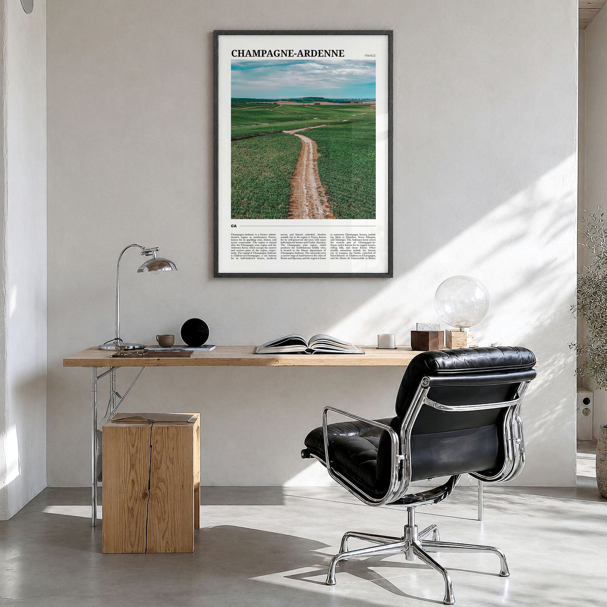 Champagne-Ardenne Travel Poster in a black wood frame, hanging in a bright home office