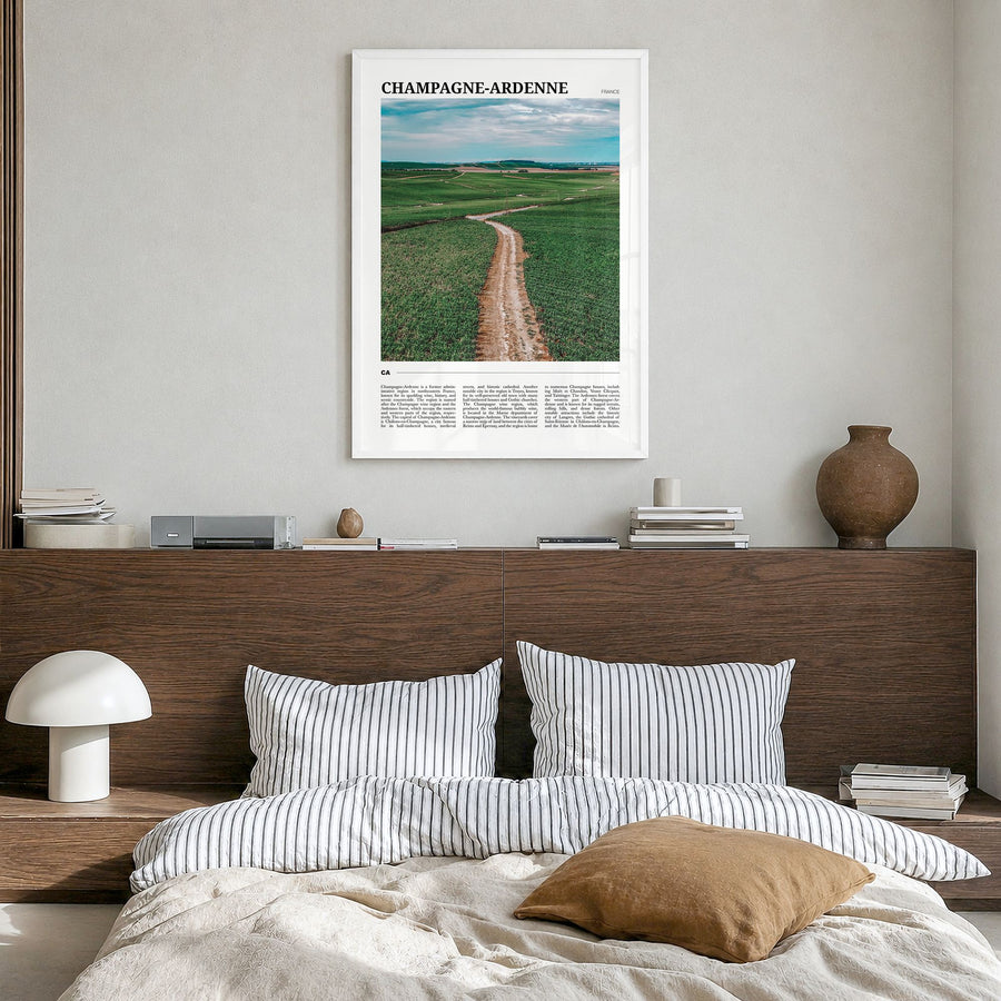 Champagne-Ardenne Travel Poster in a white wood frame, hanging in a bedroom