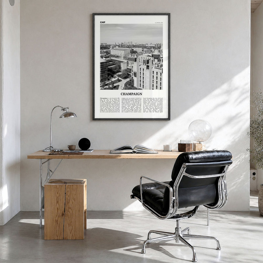 Champaign Newspaper Poster in a black wood frame, hanging in a bright home office