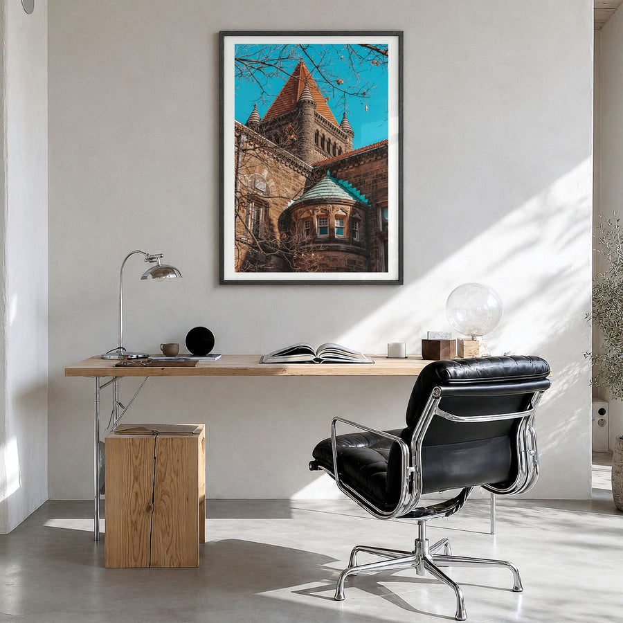 Champaign-Urbana Photo Poster in a black wood frame, hanging in a bright home office, white border