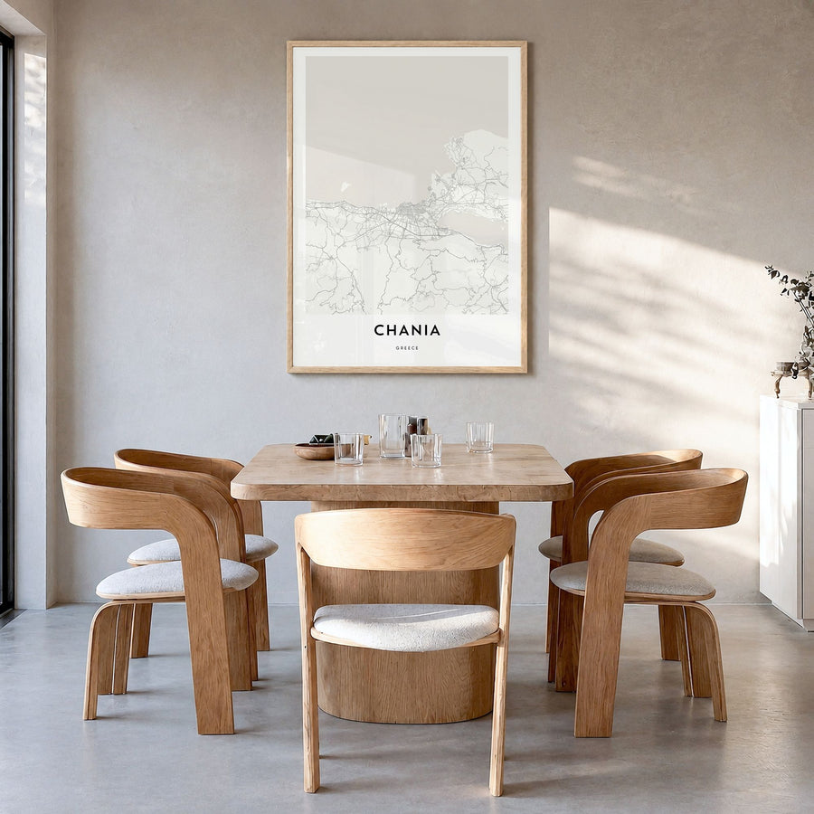 Chania Map Poster in a natural wood frame, hanging in a dining room
