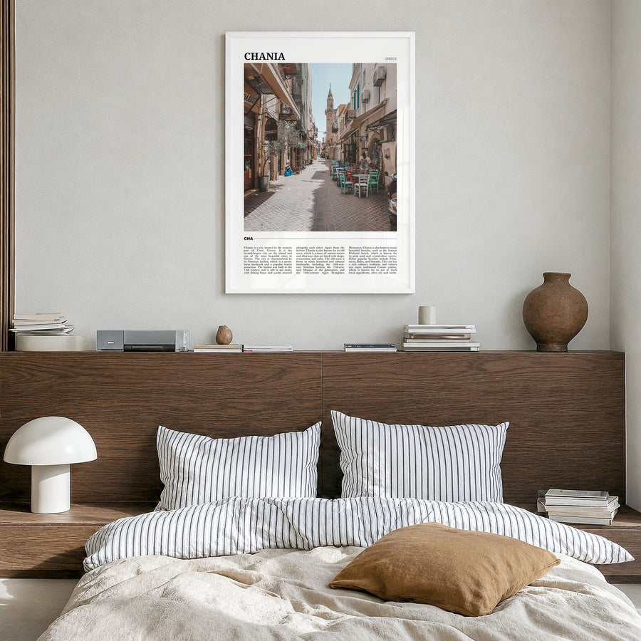Chania Travel Poster in a white wood frame, hanging in a bedroom