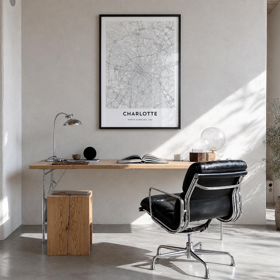 Charlotte black & white map poster of North Carolina, USA – vertical wall art in black wood frame, hanging on wall