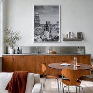 Charlotte no. 2 black & white photo poster of North Carolina, USA – vertical wall art in white wood frame, hanging on wall