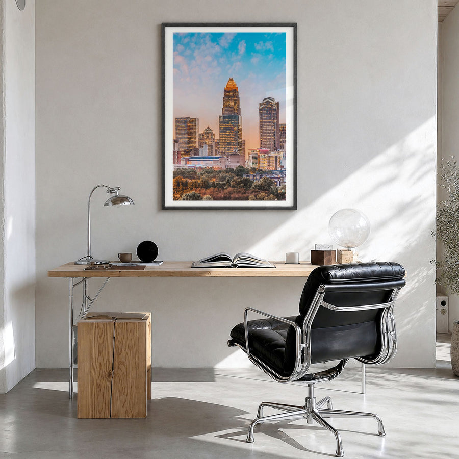 Charlotte Photo No 1 Poster in a black wood frame, hanging in a bright home office, white border