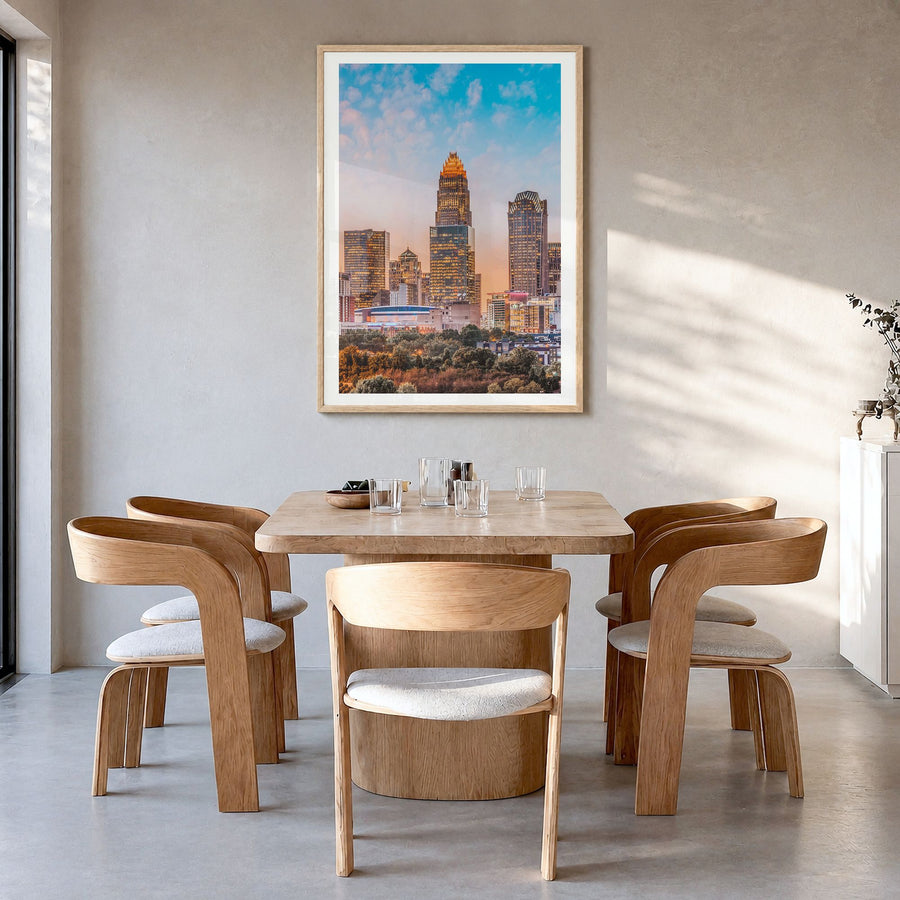 Charlotte Photo No 1 Poster in a natural wood frame, hanging in a dining room, white border