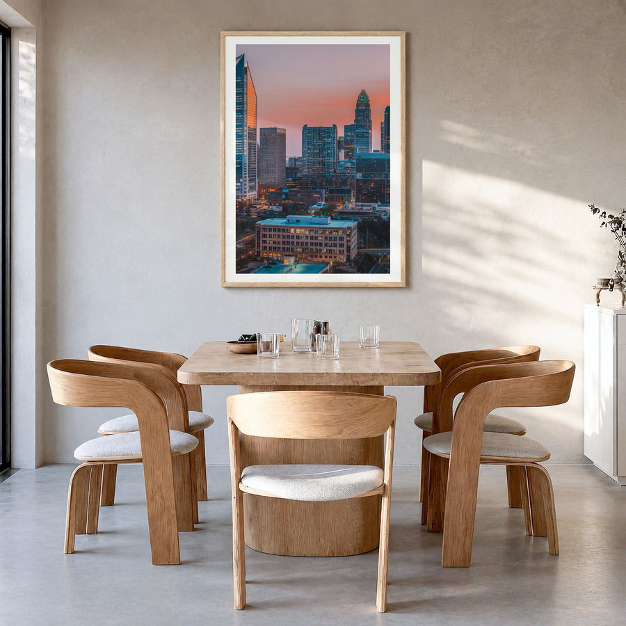 Charlotte Photo No 2 Poster in a natural wood frame, hanging in a dining room, white border