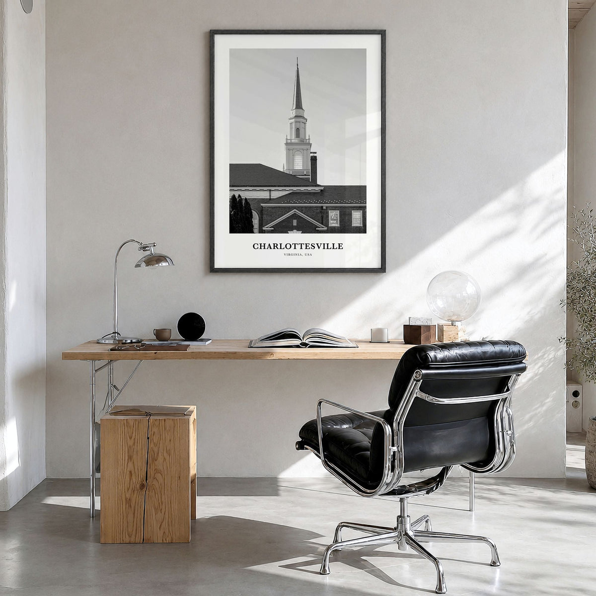 Charlottesville Classic Poster in a black wood frame, hanging in a bright home office