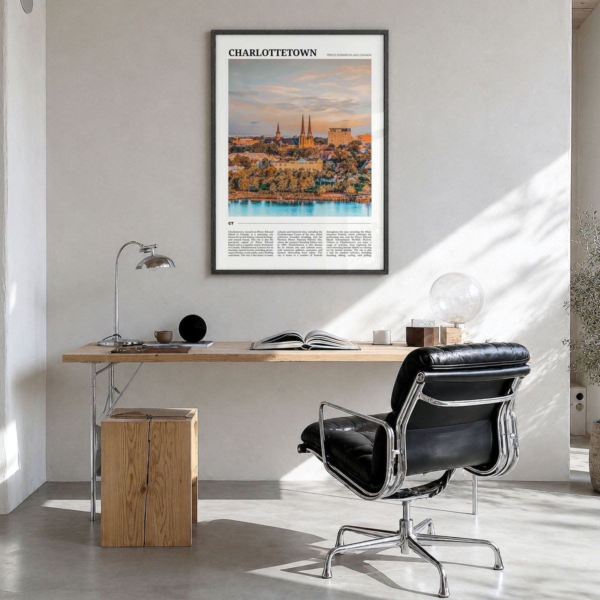 Charlottetown Travel Poster in a black wood frame, hanging in a bright home office