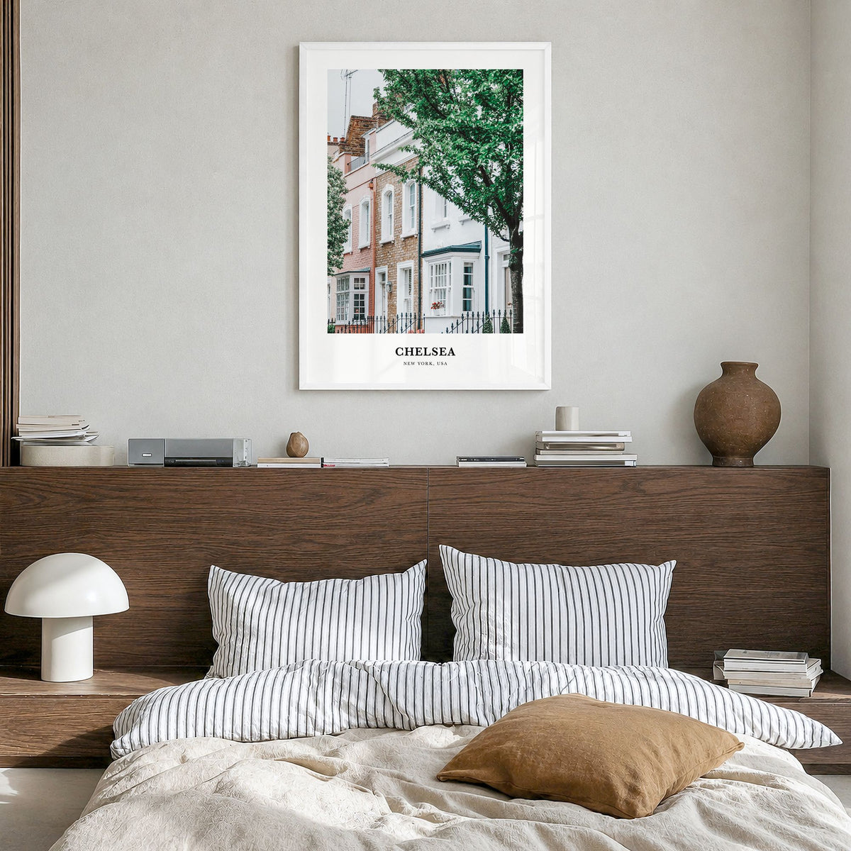 Chelsea, New York Classic Poster in a white wood frame, hanging in a bedroom