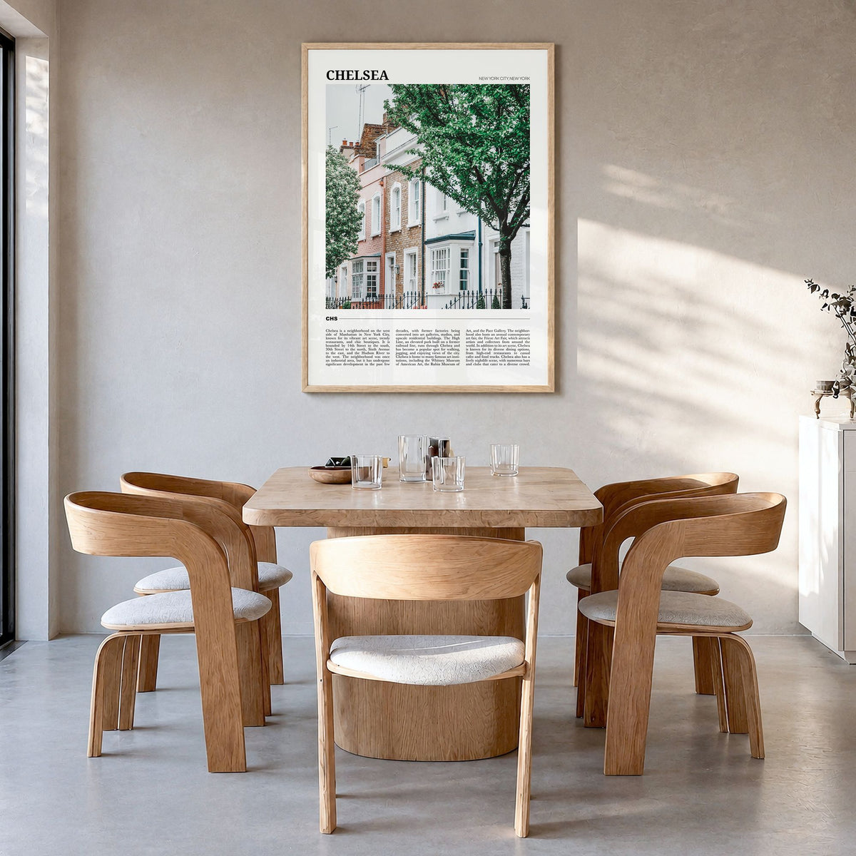 Chelsea, New York Travel Poster in a natural wood frame, hanging in a dining room