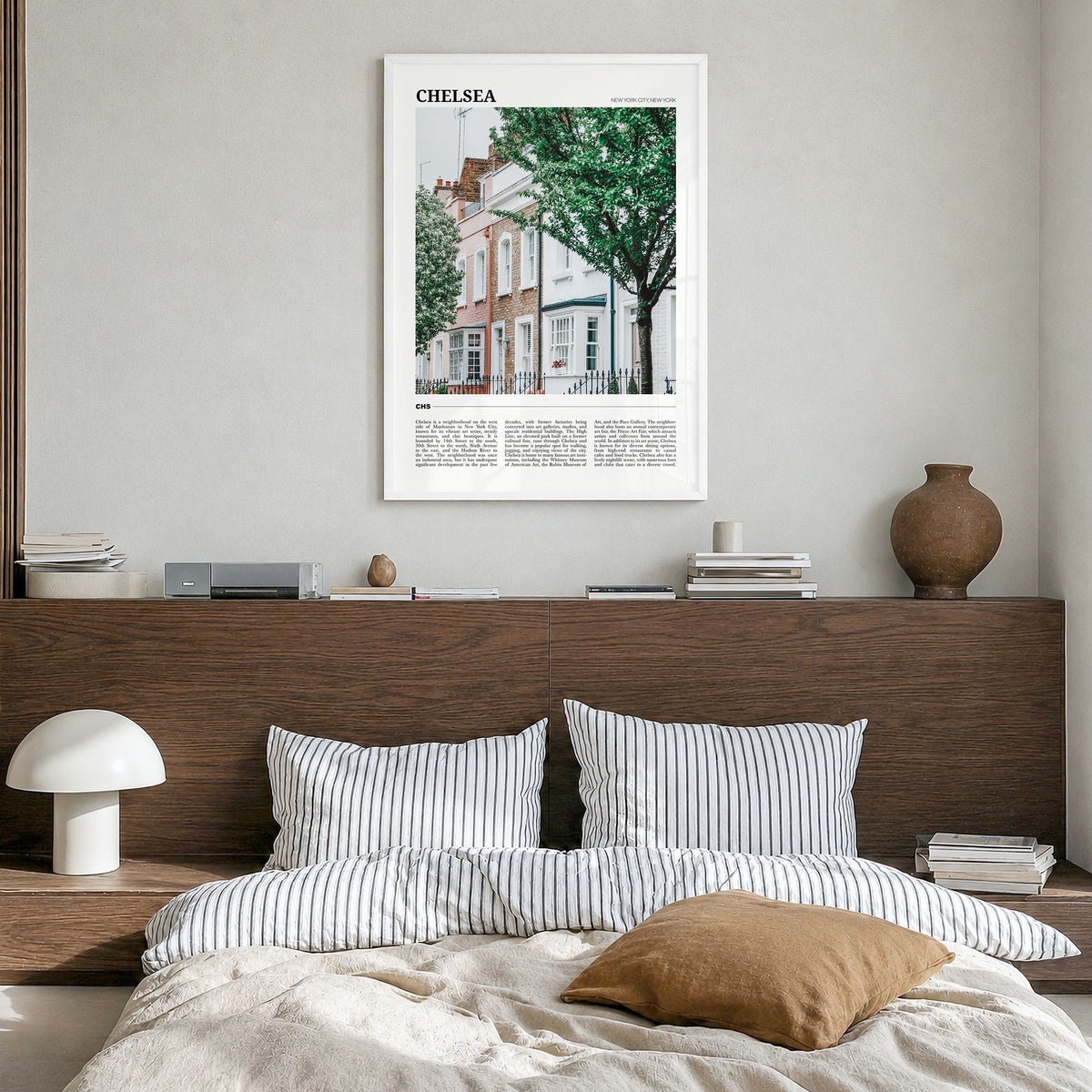 Chelsea, New York Travel Poster in a white wood frame, hanging in a bedroom