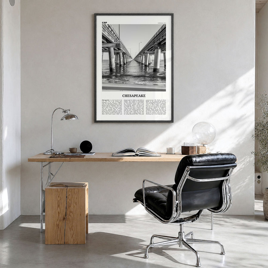 Chesapeake Newspaper Poster in a black wood frame, hanging in a bright home office