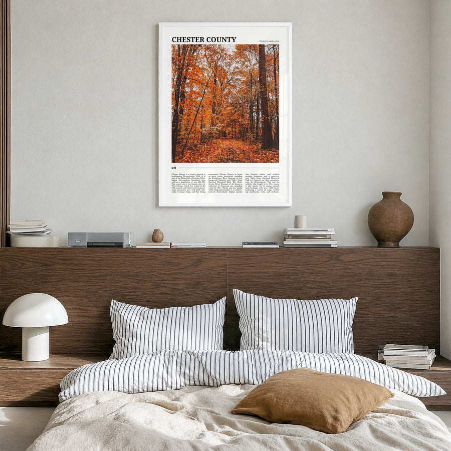 Chester County Travel Poster in a white wood frame, hanging in a bedroom