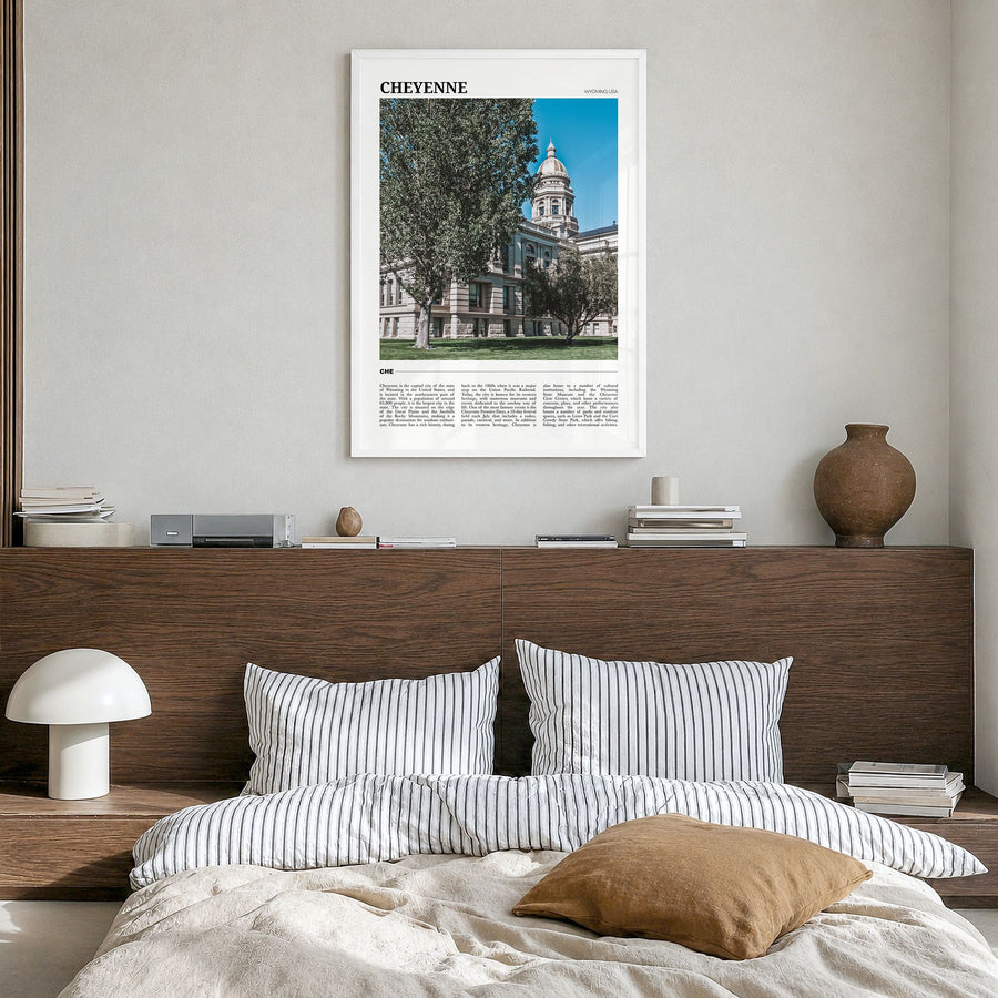 Cheyenne Travel Poster in a white wood frame, hanging in a bedroom
