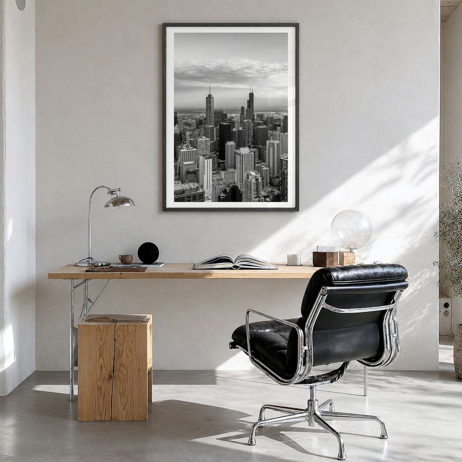Chicago Photo No 1 Poster in a black wood frame, hanging in a bright home office, white border