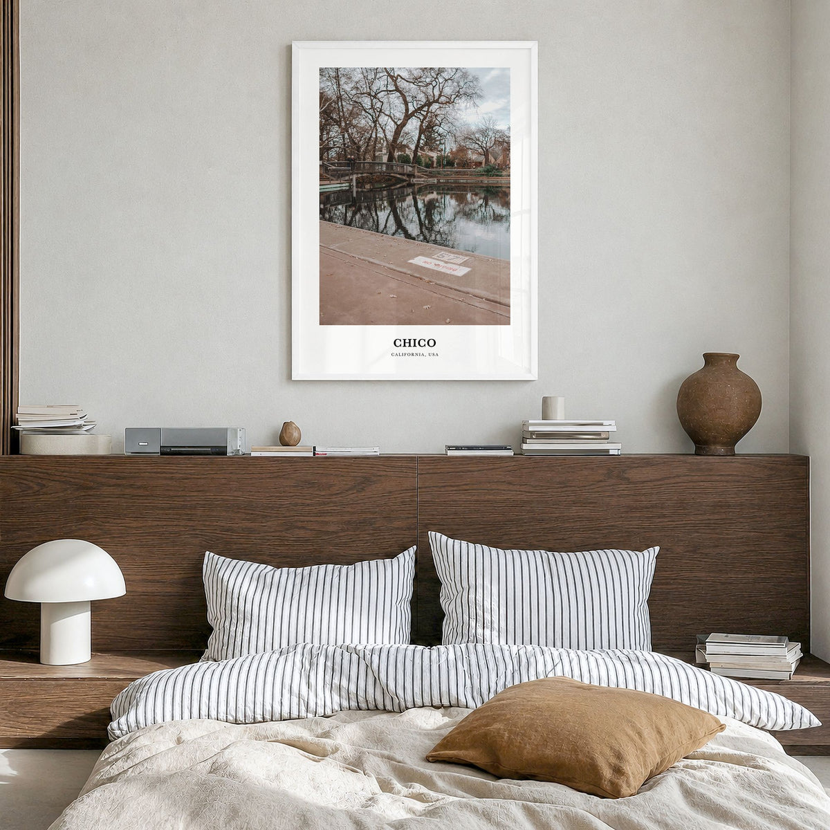Chico Classic Poster in a white wood frame, hanging in a bedroom