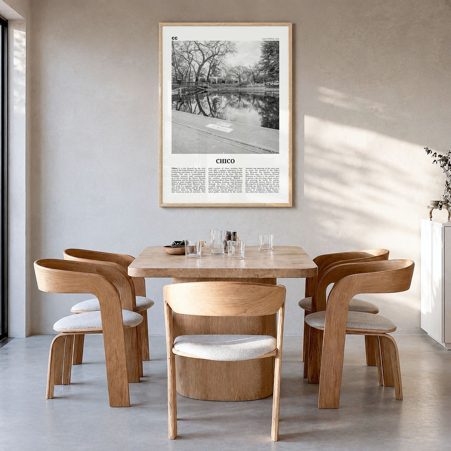 Chico Newspaper Poster in a natural wood frame, hanging in a dining room