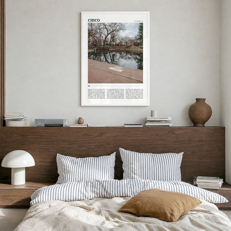 Chico Travel Poster in a white wood frame, hanging in a bedroom