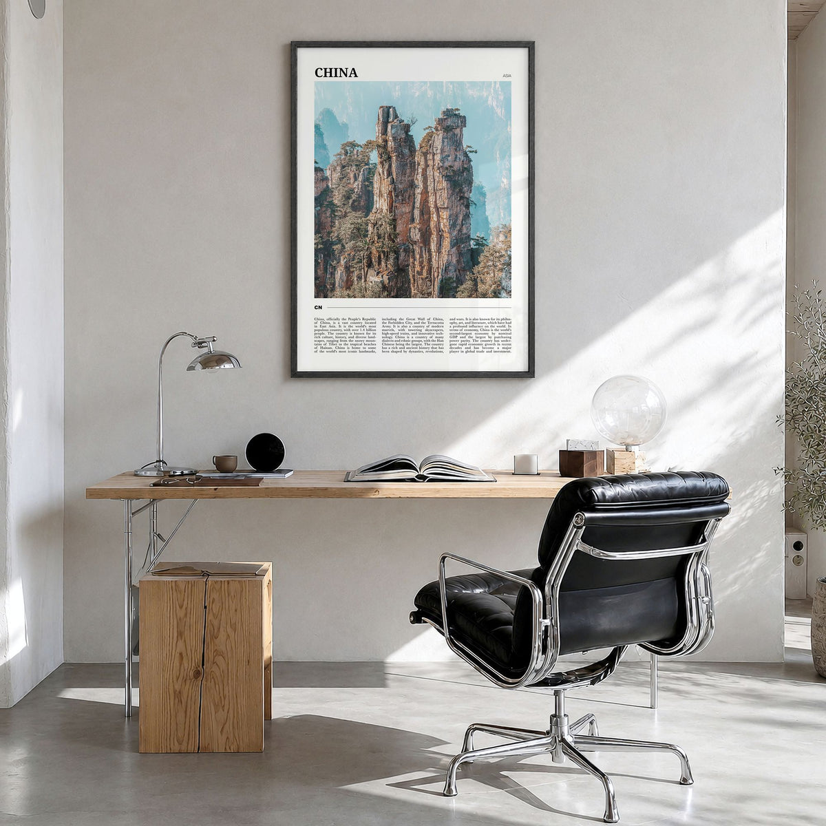 China Travel Poster in a black wood frame, hanging in a bright home office