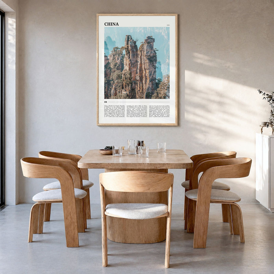China Travel Poster in a natural wood frame, hanging in a dining room